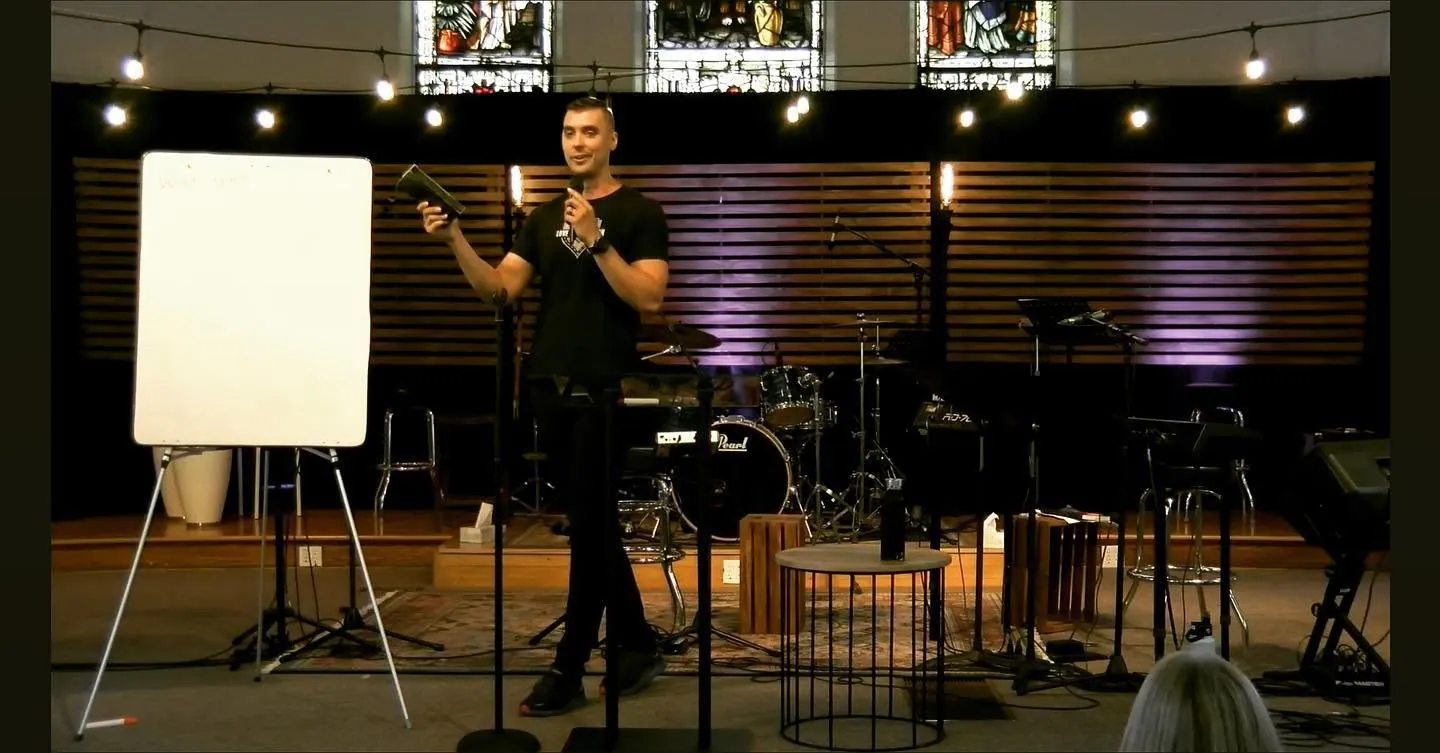 Teaching at a whiteboard during a church equipping session