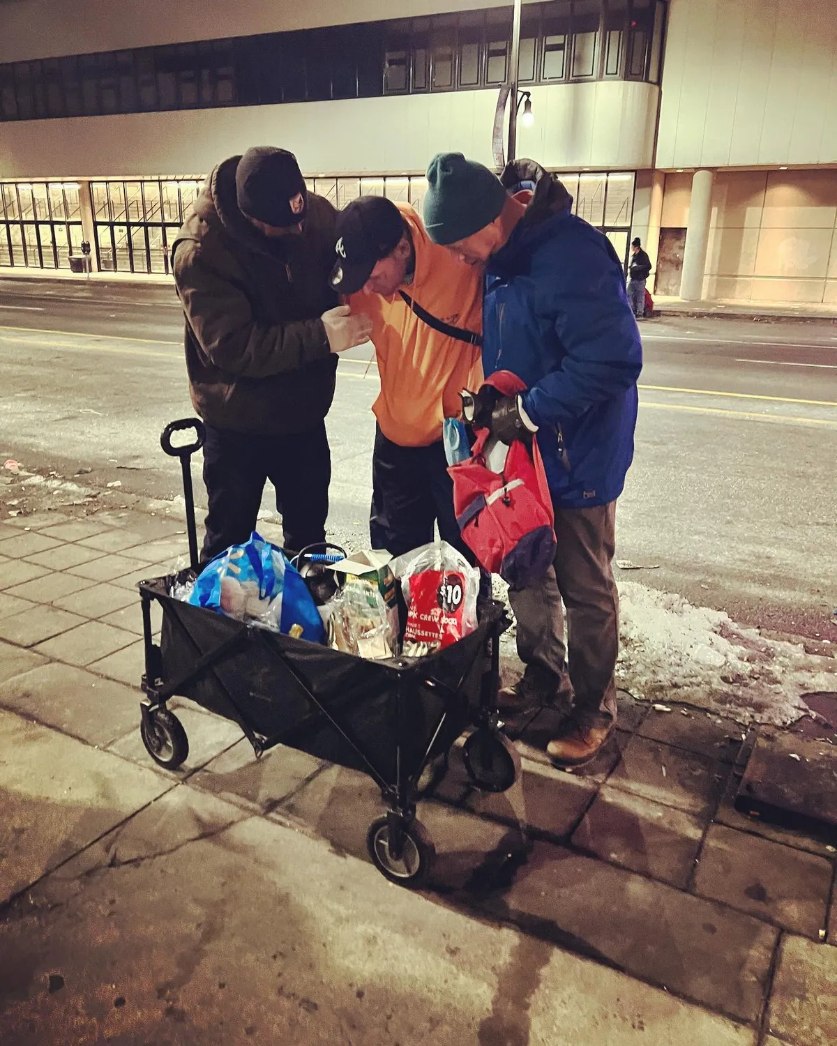 Believers sharing stories together during ministry outreach