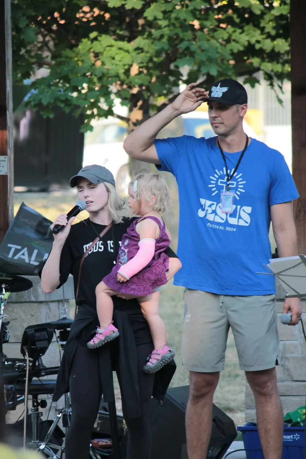 A family together at an outdoor community worship event